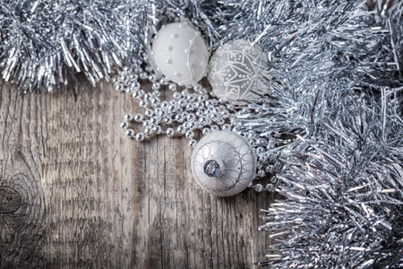 White christmas balls on a wooden background.の写真素材