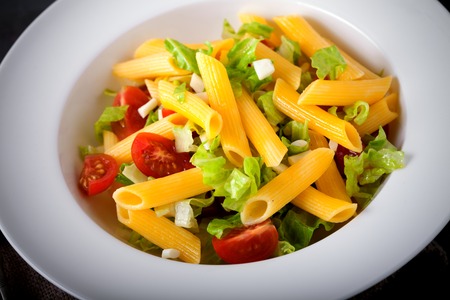 Italian Pasta salad served in a white plateの写真素材