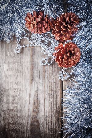 Home decor pine cones on a wooden background. の写真素材