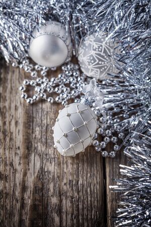 White christmas balls on a wooden background. の写真素材