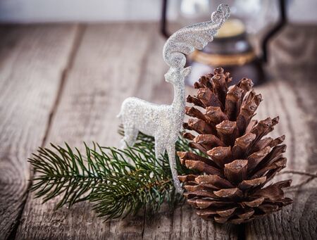 Christmas ornaments and old lamp on rustic wood.の写真素材
