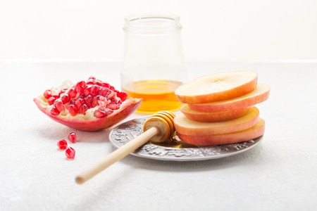 Apples, pomegranate and honey for Rosh Hashanah .の写真素材