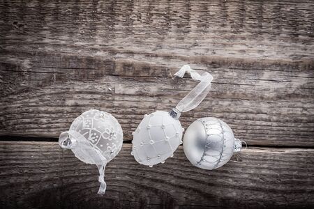 White christmas balls on a wooden backgroundの写真素材