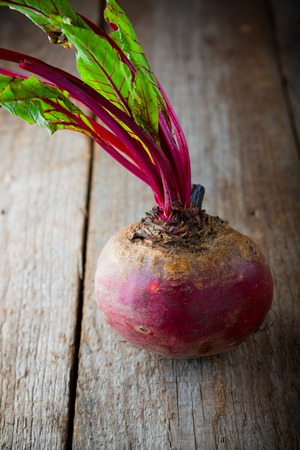 Fresh organic beet on a wood table.の写真素材