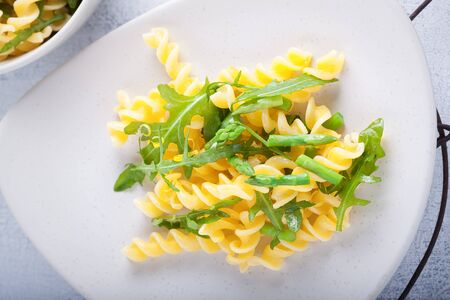 Pasta salad with asparagus and arugulaの写真素材