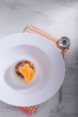 Coconut panna cotta with slices of oranges. の写真素材
