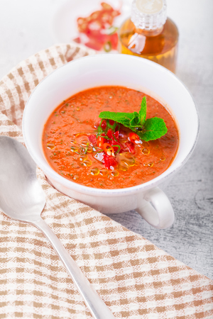Bowl of fresh tomato soup gazpacho on a napkin.の写真素材