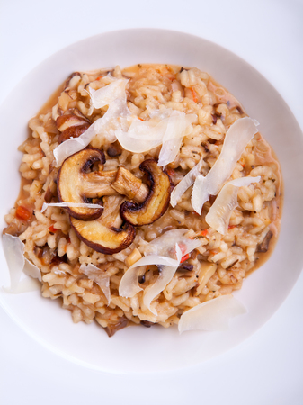 Mushroom risotto Italian cuisine placed on a white background.の写真素材