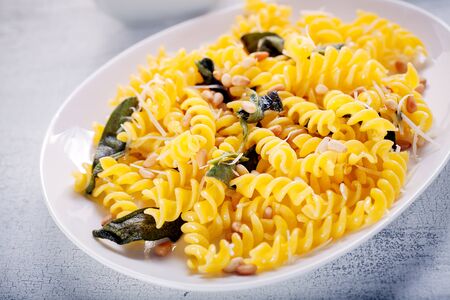 Fusilli pasta with sage and pine nuts. Gluten free. Flour from rice and corn flourの写真素材
