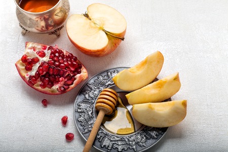 Apples, pomegranate and honey for Rosh Hashanahの写真素材