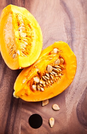 A slice of fresh Pumpkin on wooden table.の写真素材