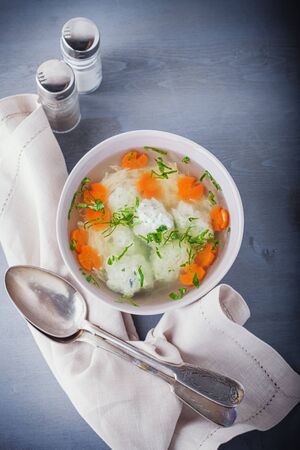 Chicken soup with meatballs and vegetablesの写真素材