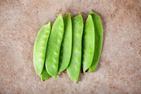 Green peas on ceramic surfaceの写真素材