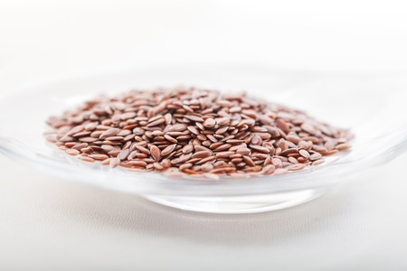 Flax seed in glass bowlの写真素材