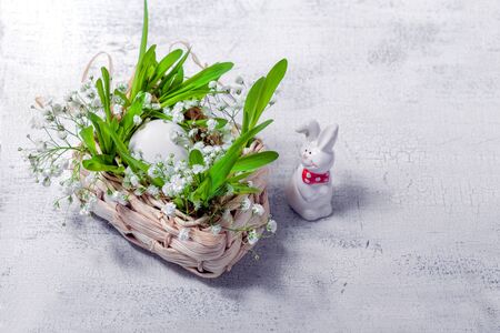 Bunny, eggs and white flowers Easter symbols
