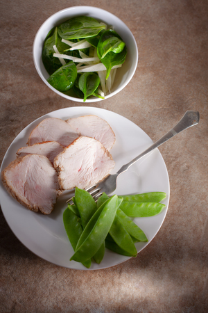 Turkey breast with green saladの写真素材