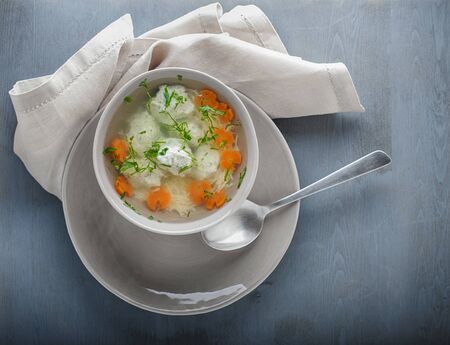 Chicken soup with meatballs and vegetablesの写真素材