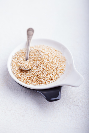 Raw quinoa on wooden tableの写真素材