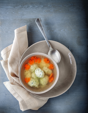 Chicken soup with meatballs and vegetables.の写真素材