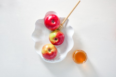 Apples, pomegranate and honey for Rosh Hashanahの写真素材