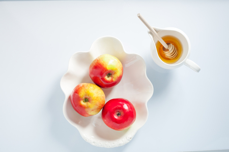 Apples, pomegranate and honey for Rosh Hashanahの写真素材