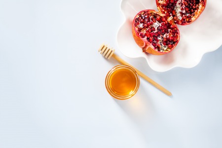 Apples, pomegranate and honey for Rosh Hashanahの写真素材
