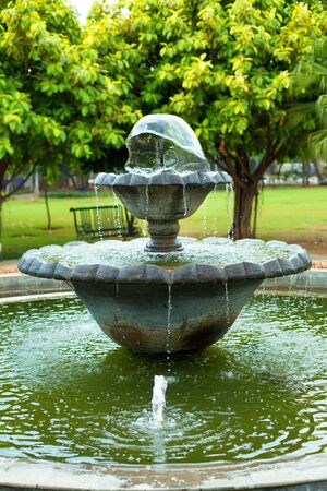 a small fountain in a parkの写真素材