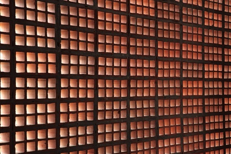 Brown-coloured wall constructed from hollow bricks, shot from perspective angleの写真素材