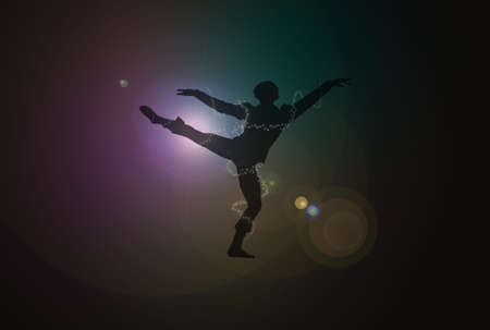 Silhouette of a male dancer over dark background with flaresの写真素材