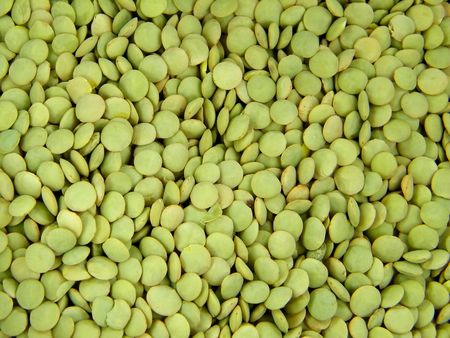 Plenty of green lentils background over planの写真素材