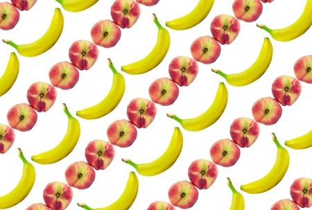 Background made of bananas and peaches isolated over whiteの写真素材
