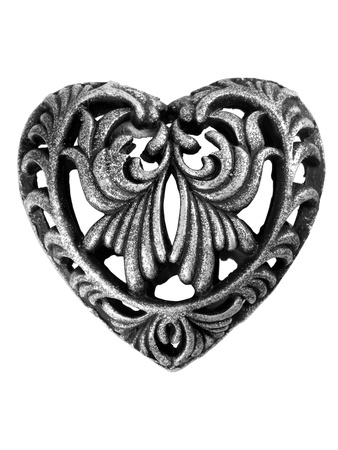 Metallic heart with abstract swirls isolated over white backgroundの写真素材