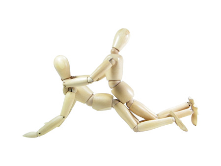 Two wood puppets having sex isolated over white backgroundの写真素材