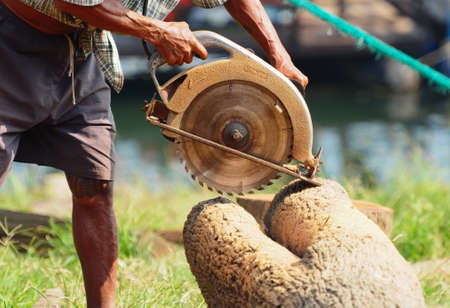 Worker with a saw in handの写真素材