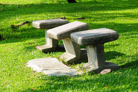 stone chairs standing on the gardenの写真素材