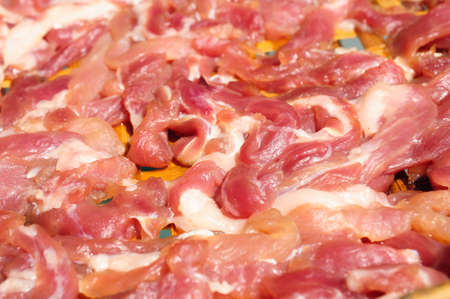 bacon drying in the sunの写真素材