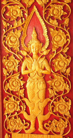 Traditional Thai style carving and painting art at the templeの写真素材