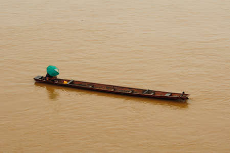 Fisherman in the boat at Mekong River