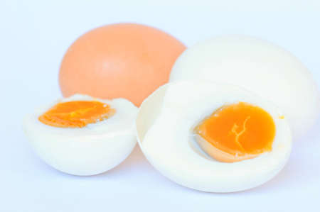 Eggs Salted cut in half on a white background