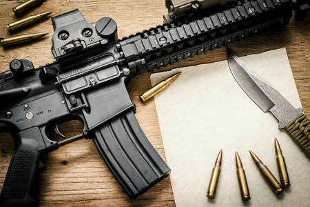 Rifle, paper, bullets and knife