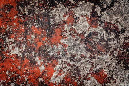 old red cracked paint on concrete backgroundの写真素材