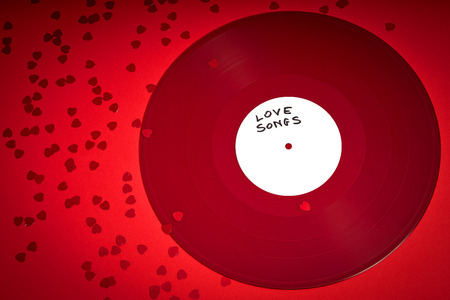 Valentines Day background with red LP record with love songs on red background
