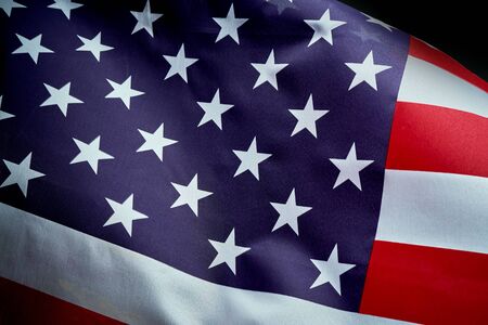 US flag waving in wind on Independence Day in Americaの写真素材