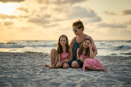 Family vacation sunset happy together at the beach. High quality photoの写真素材