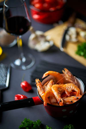 black shrimp table with wine noodles and spicesの写真素材