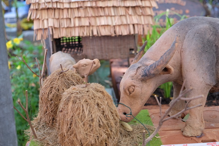 Buffalo sculpture and rice strawの写真素材