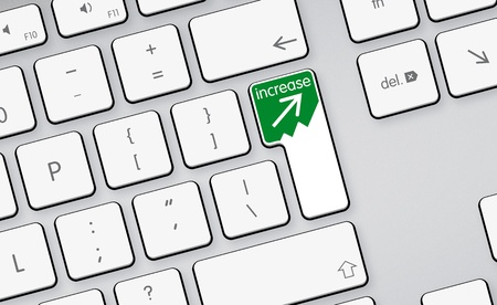 increase green arrow icon button on white keyboardの写真素材