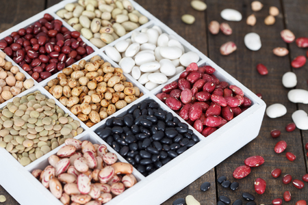 Sources of protein: lentils, beans, kidney beans, chickpeas on wooden tableの写真素材
