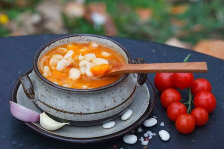 Rustic Kidney Bean Soup with beans and carrots. Other ingridients for cooking on table.の写真素材