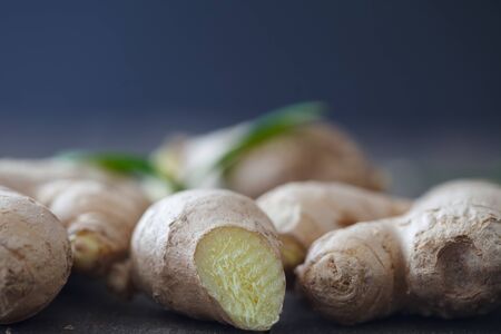 Fresh ginger root on dark background. Close up, Selective focusの写真素材